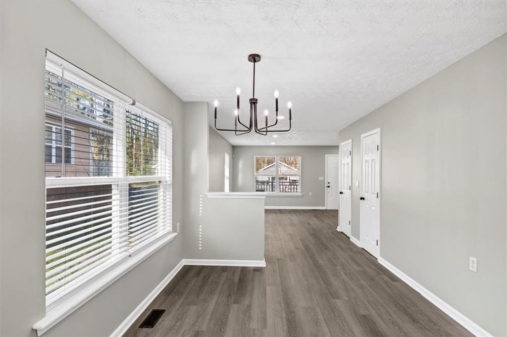 2478 Verbena Circle Northwest Atlanta, GA 30314 - Photo 9 of 42 a view of empty room with wooden floor and fan