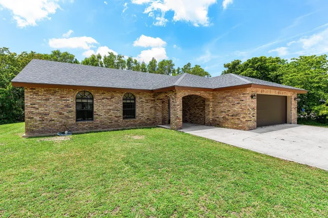 front view of a house with a yard