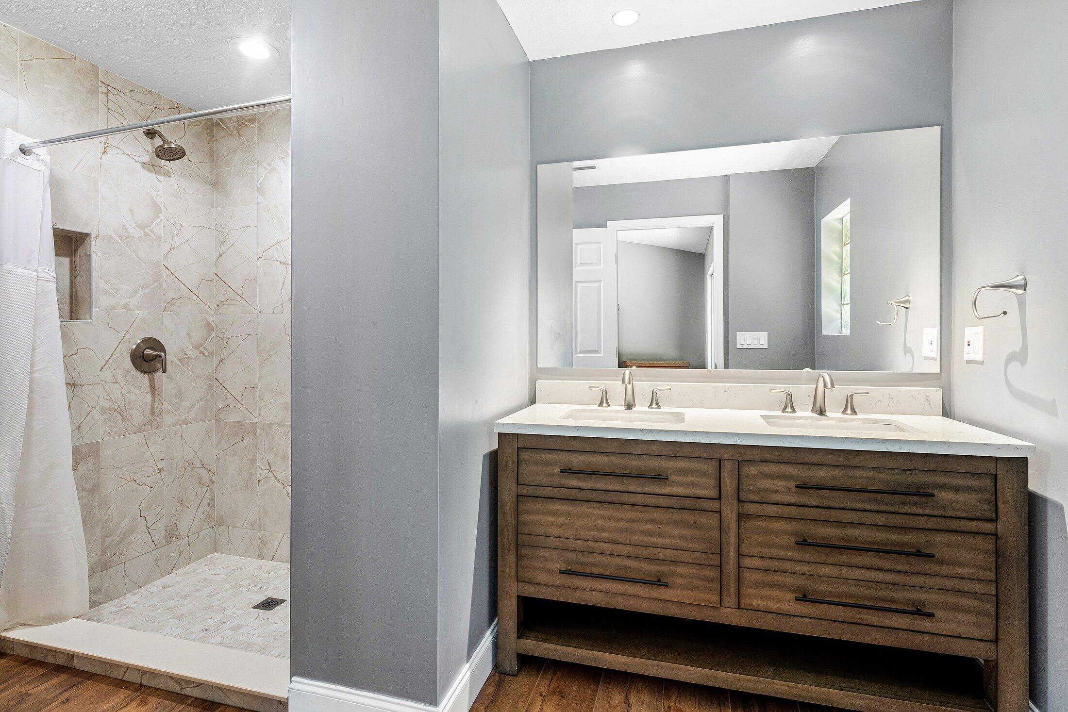 18142 43rd Road North Loxahatchee, FL 33470 - Photo 17 of 42 a bathroom with a granite countertop sink mirror and double