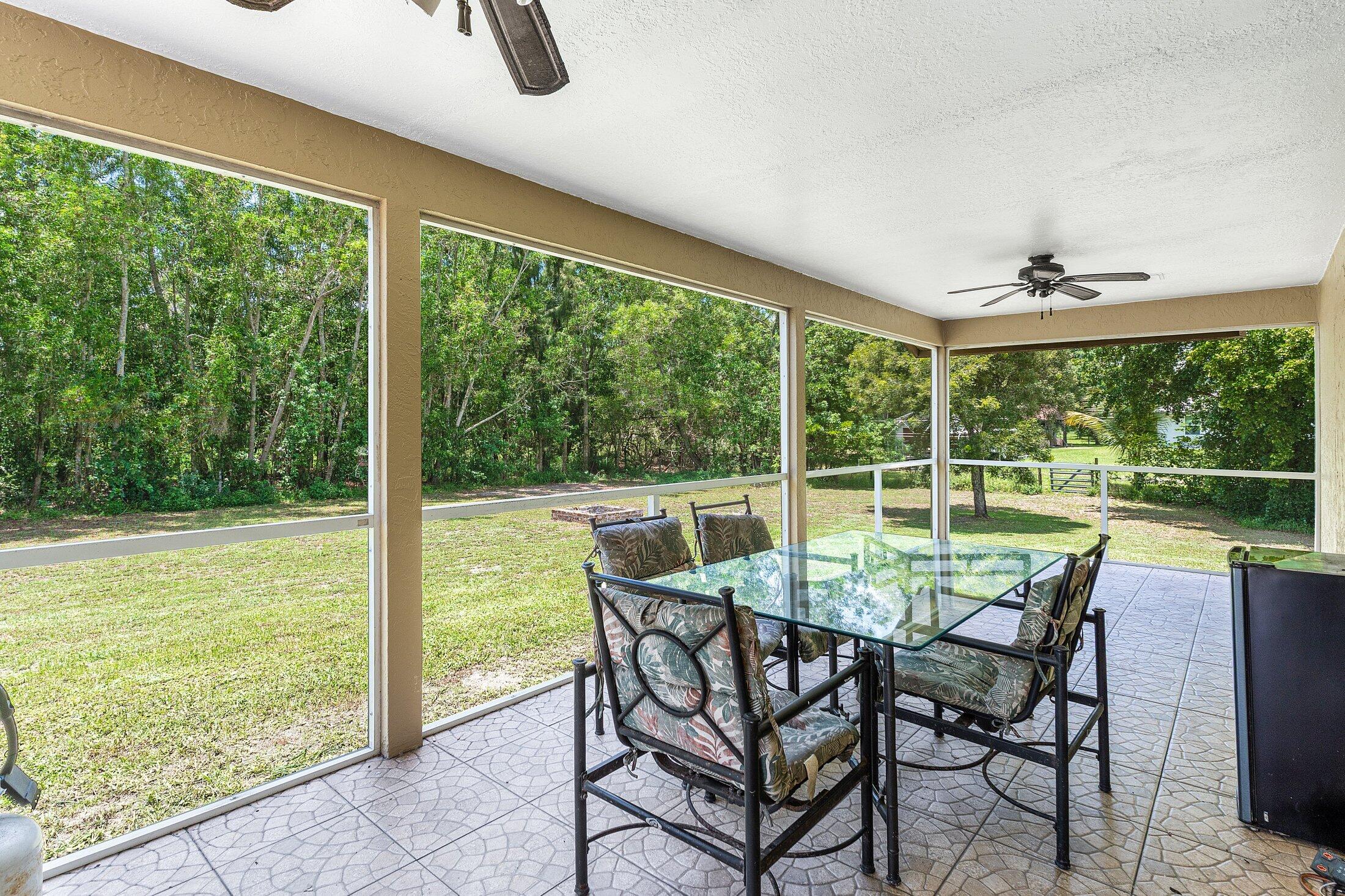 18142 43rd Road North Loxahatchee, FL 33470 - Photo 23 of 42 a view of an outdoor space with seating area