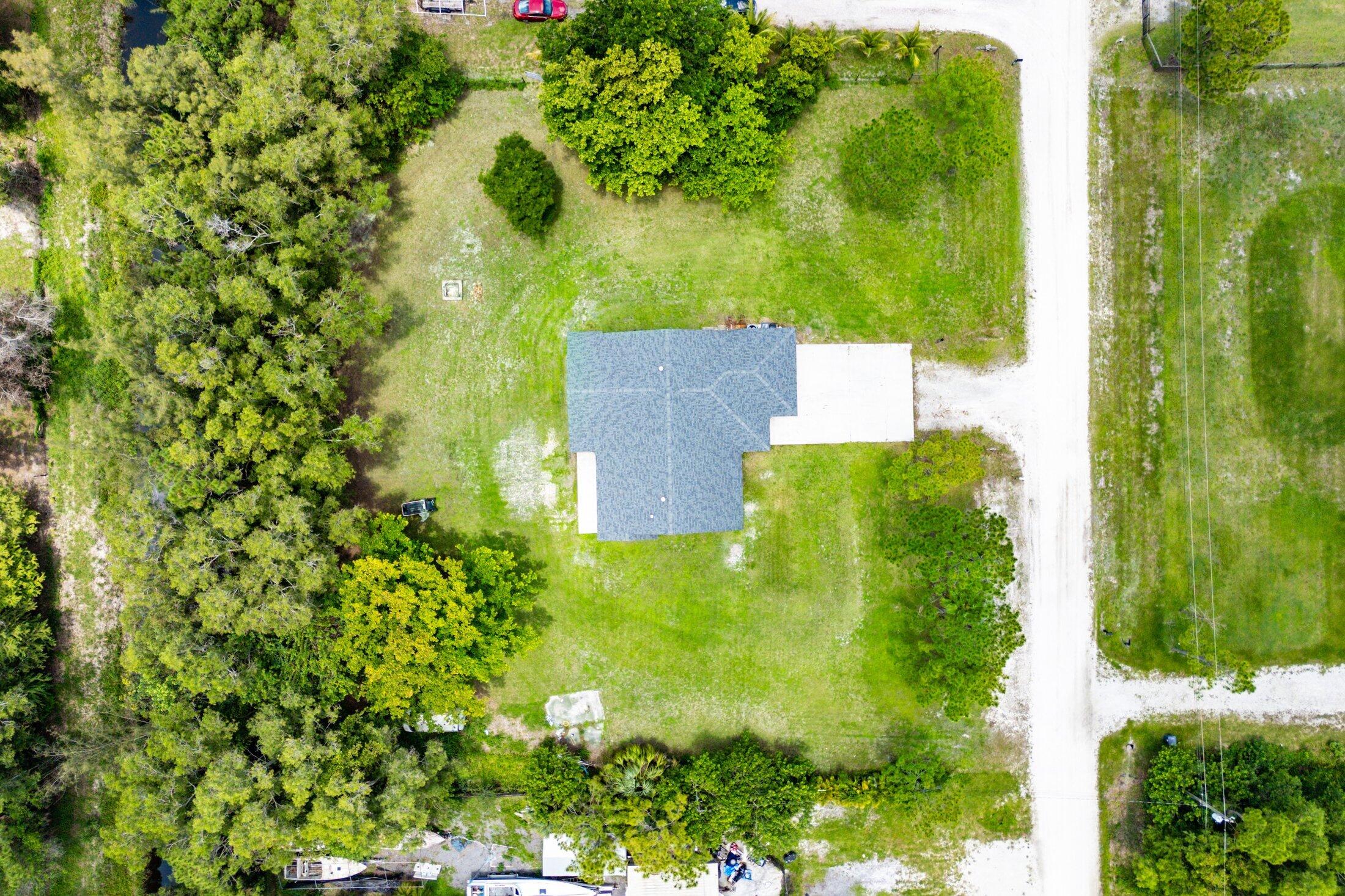 18142 43rd Road North Loxahatchee, FL 33470 - Photo 41 of 42 an aerial view of residential house with an outdoor space