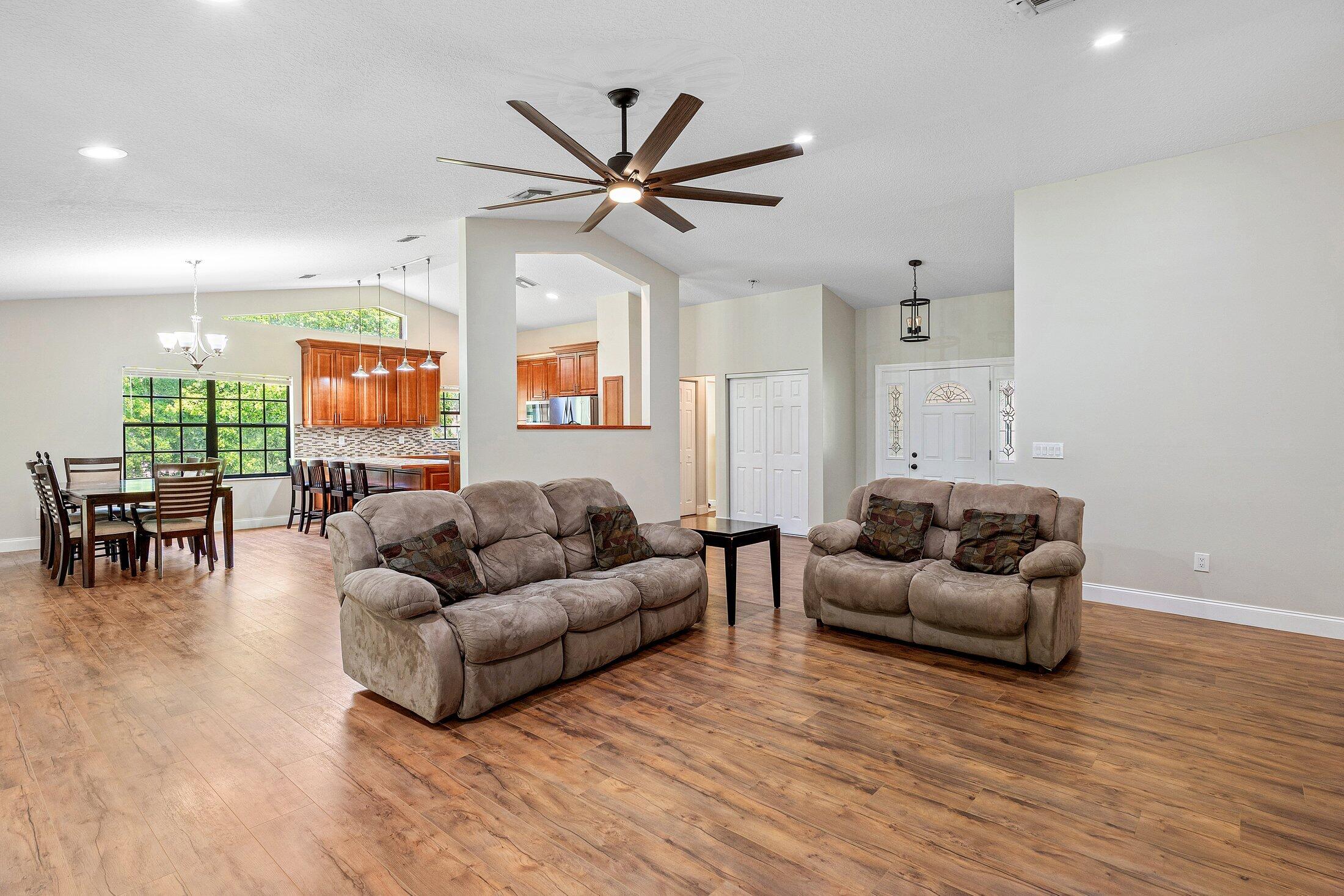 18142 43rd Road North Loxahatchee, FL 33470 - Photo 10 of 42 a living room with furniture and a large window