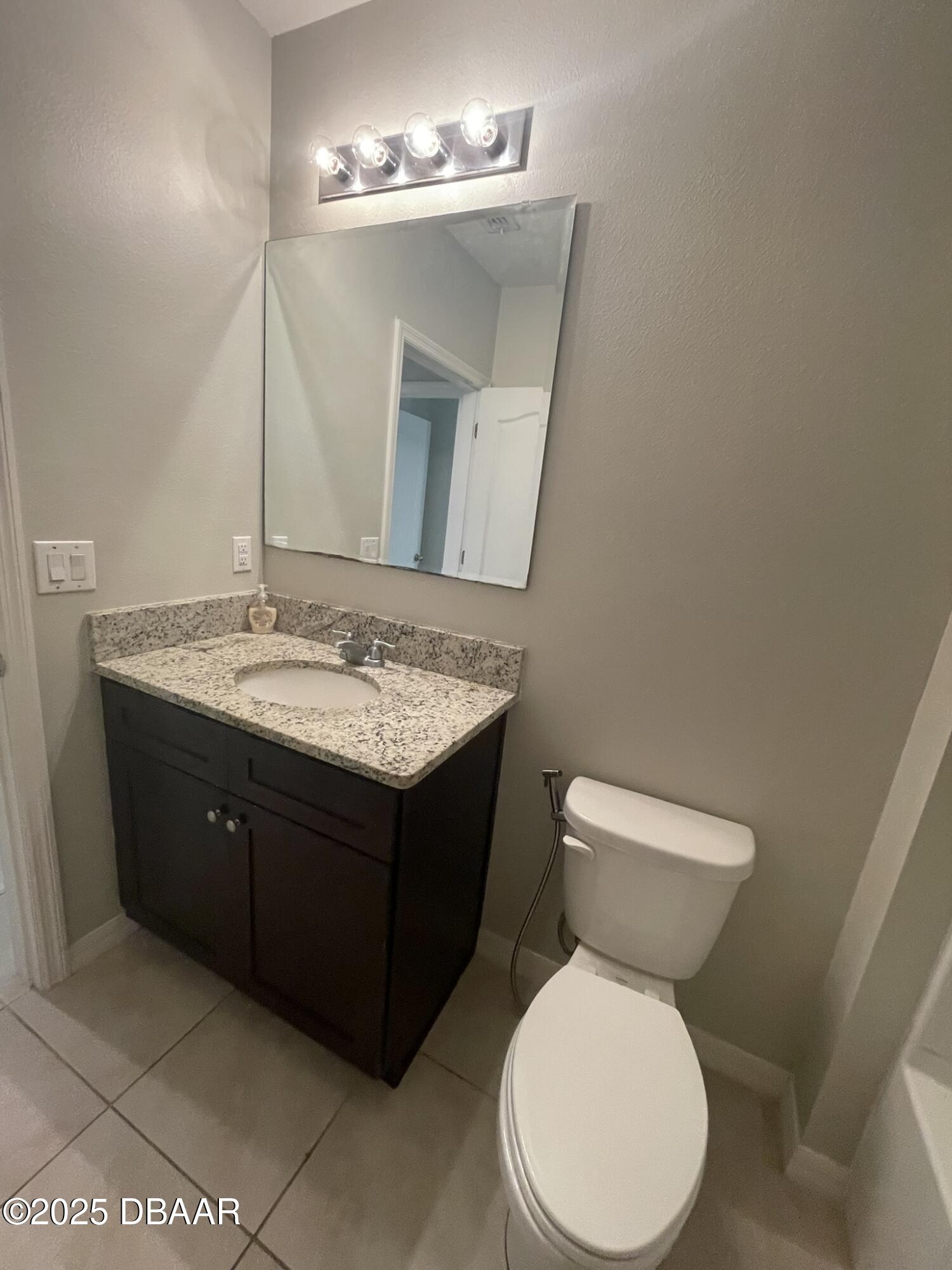 5343 Sandpine Haven Lane Port Orange, FL 32128 - Photo 13 of 44 a bathroom with a toilet sink and mirror