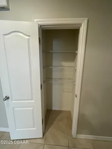 a view of kitchen with microwave cabinets and refrigerator