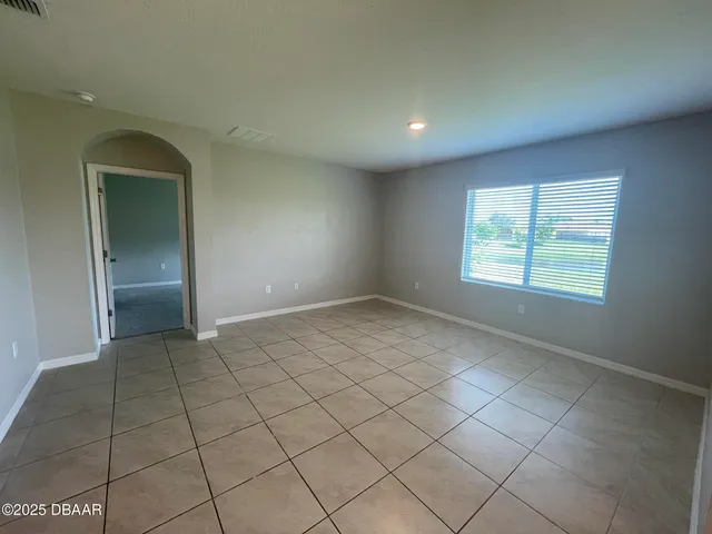 a view of a field with an ocean view