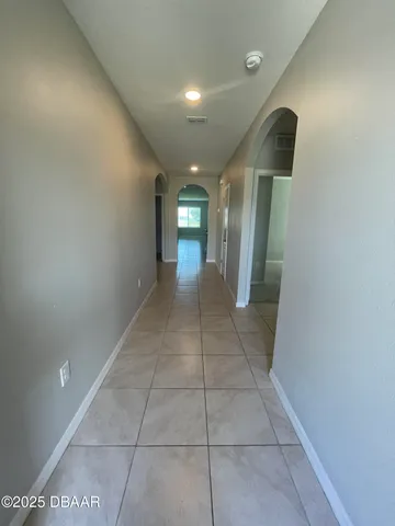 a view of hallway with a window and a mirror