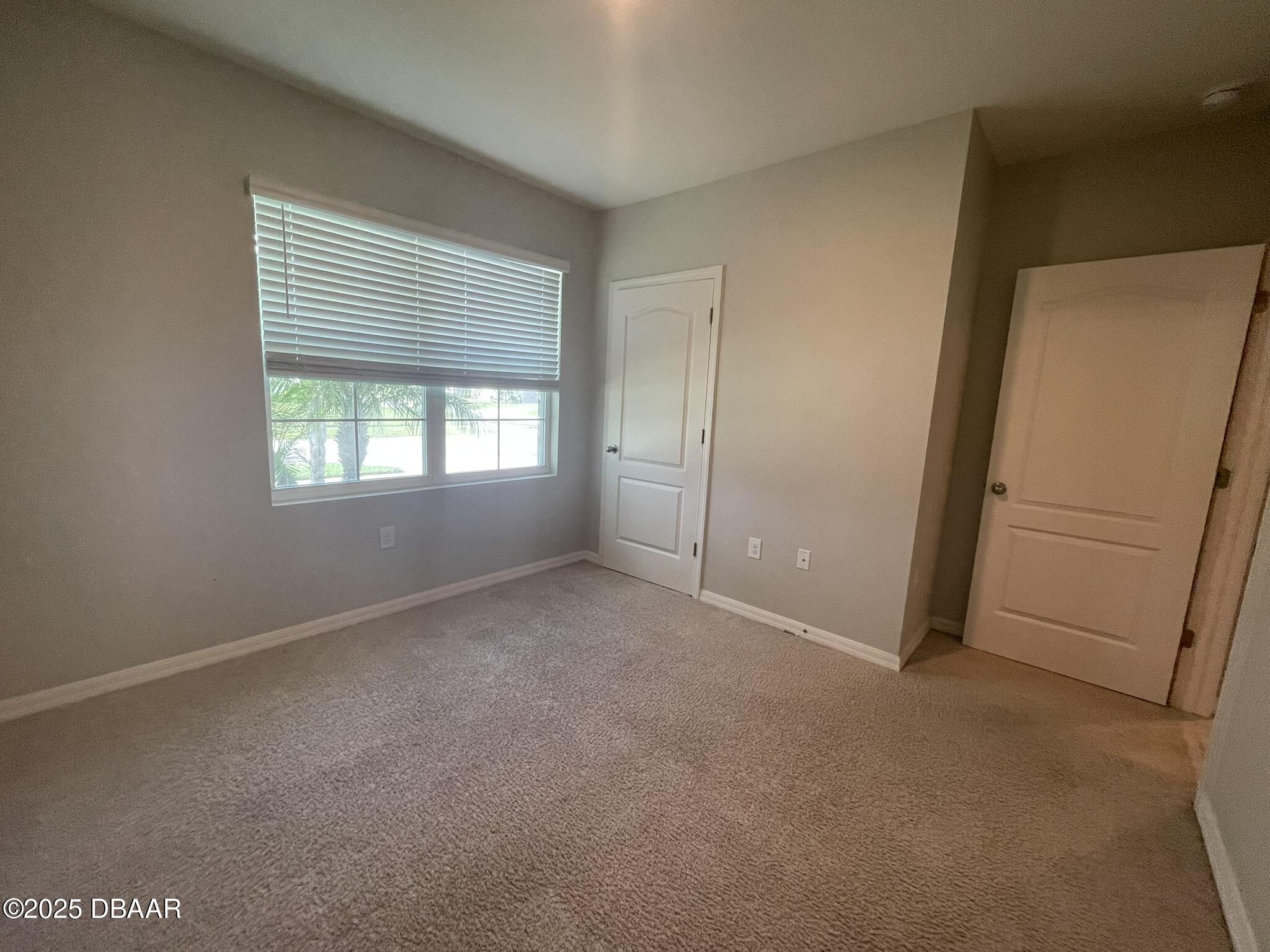 5343 Sandpine Haven Lane Port Orange, FL 32128 - Photo 7 of 44 an empty room with windows