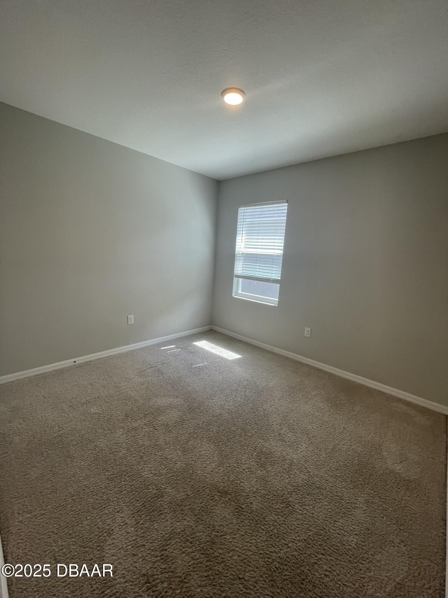 5343 Sandpine Haven Lane Port Orange, FL 32128 - Photo 9 of 44 an empty room with a window