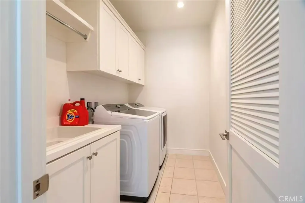141 Dolci Irvine, CA 92606 - Photo 13 of 13 a utility room with dryer and washer