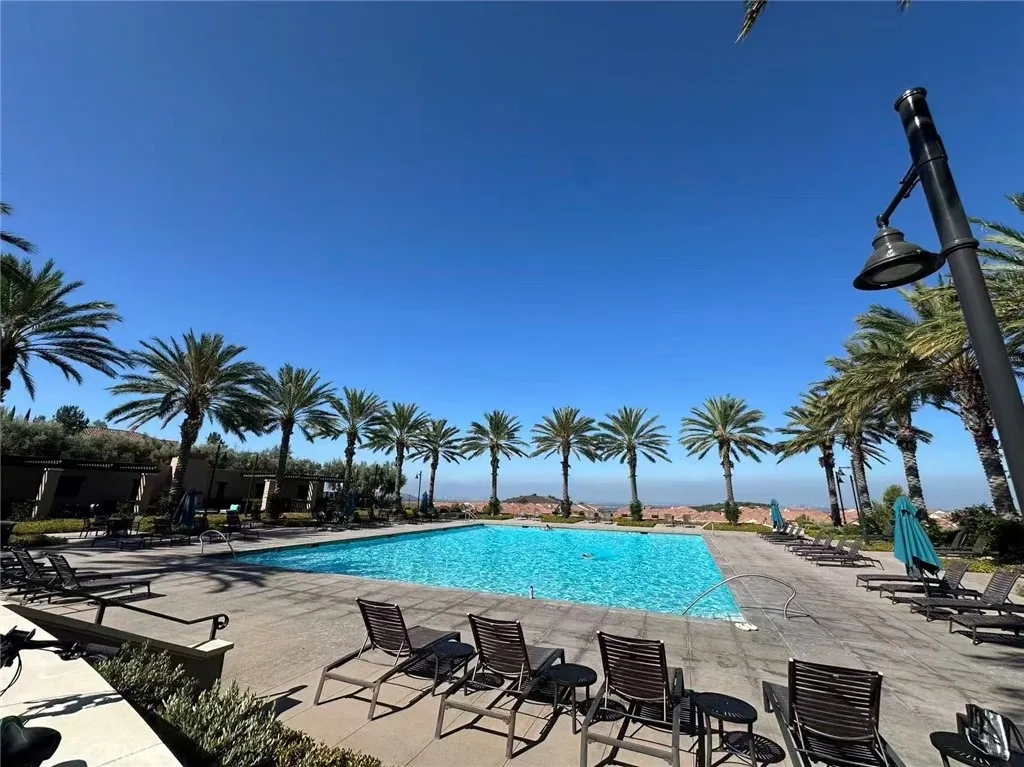 141 Dolci Irvine, CA 92606 - Photo 5 of 13 a view of a patio with swimming pool