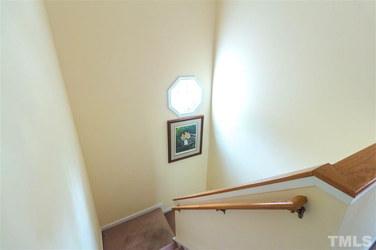 1011 Dual Parks Road Apex, NC 27502 - Photo 10 of 21 Very well lit stairway with octagonal window.