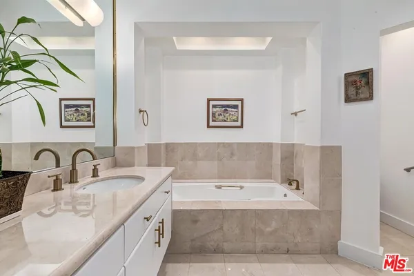 a bathroom with a sink and a bathtub