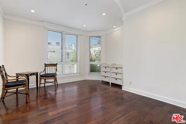 a view of a livingroom with furniture and wooden floor