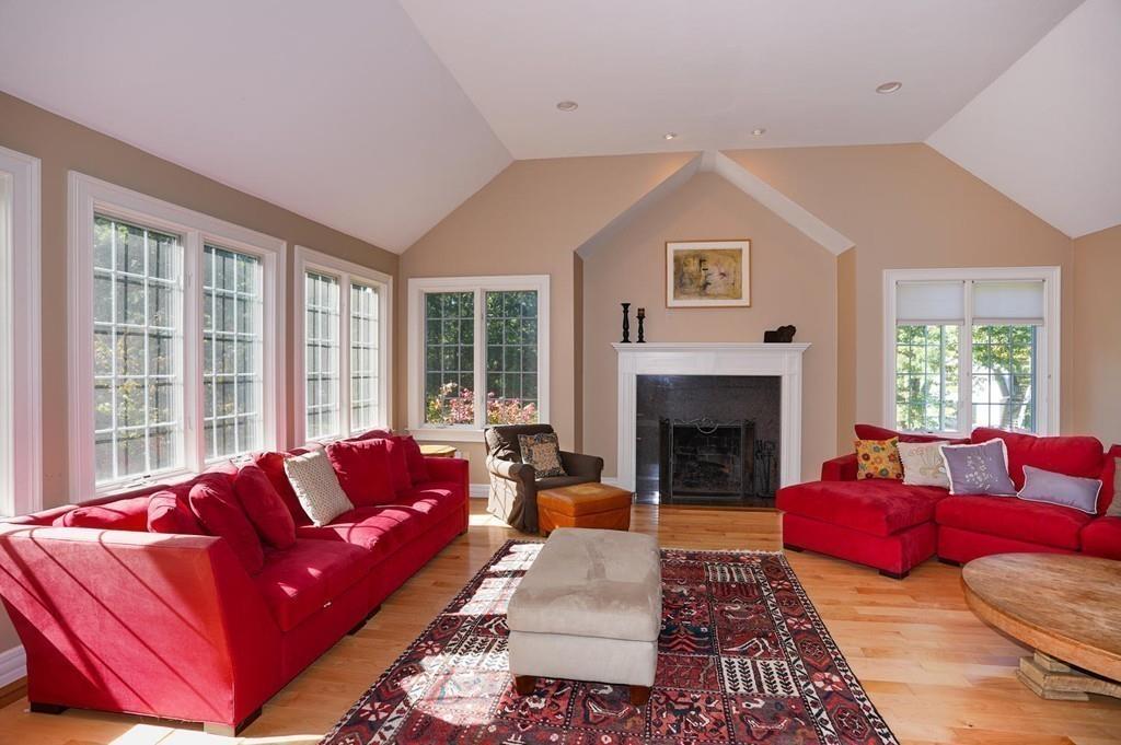 32 Frye Road Bolton, MA 01740 - Photo 3 of 35 a living room with furniture or couch and a fireplace