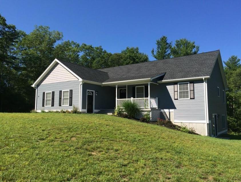 9 Fieldstone Road Killingly, CT 06241 - Photo 1 of 1 a front view of a house with a garden