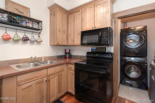 a kitchen with cabinets and a stove top oven