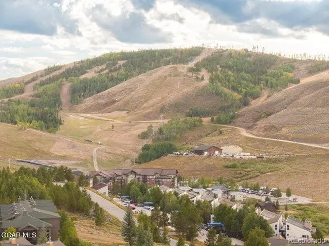 a view of a town with mountains in the background