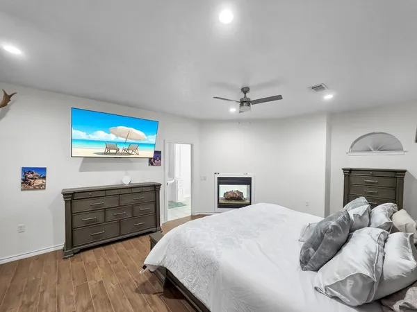 a bedroom with a bed and a dresser