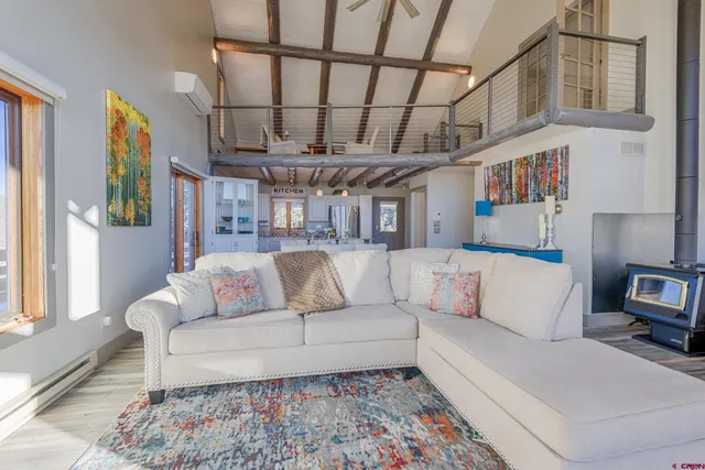 a en suite bathroom with a granite countertop double vanity sink and a mirror