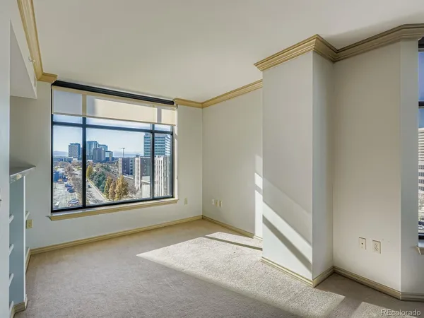 an empty room with large window