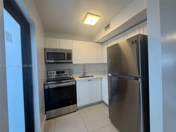 a bathroom with a shower and toilet
