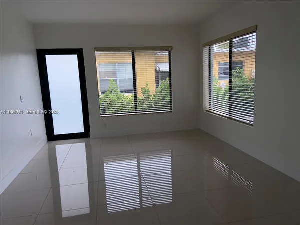 a view of an empty room with a window