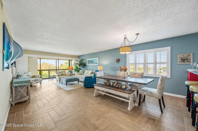 a living room with furniture fireplace and a flat screen tv