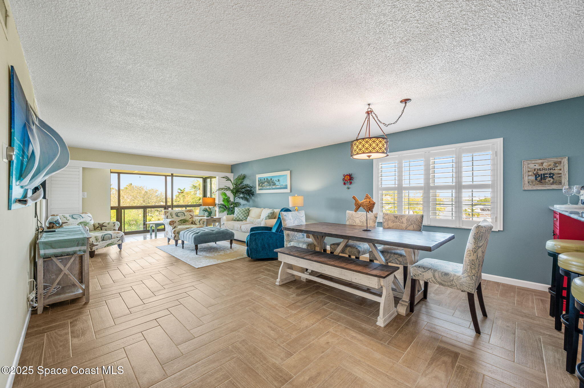 2001 South Banana River Boulevard, Unit 319 Cocoa Beach, FL 32931 - Photo 13 of 45 a living room with furniture fireplace and a flat screen tv