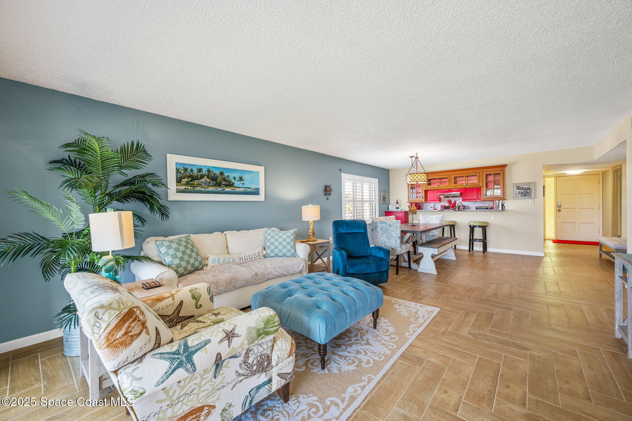 2001 South Banana River Boulevard, Unit 319 Cocoa Beach, FL 32931 - Photo 17 of 45 a living room with furniture and wooden floor
