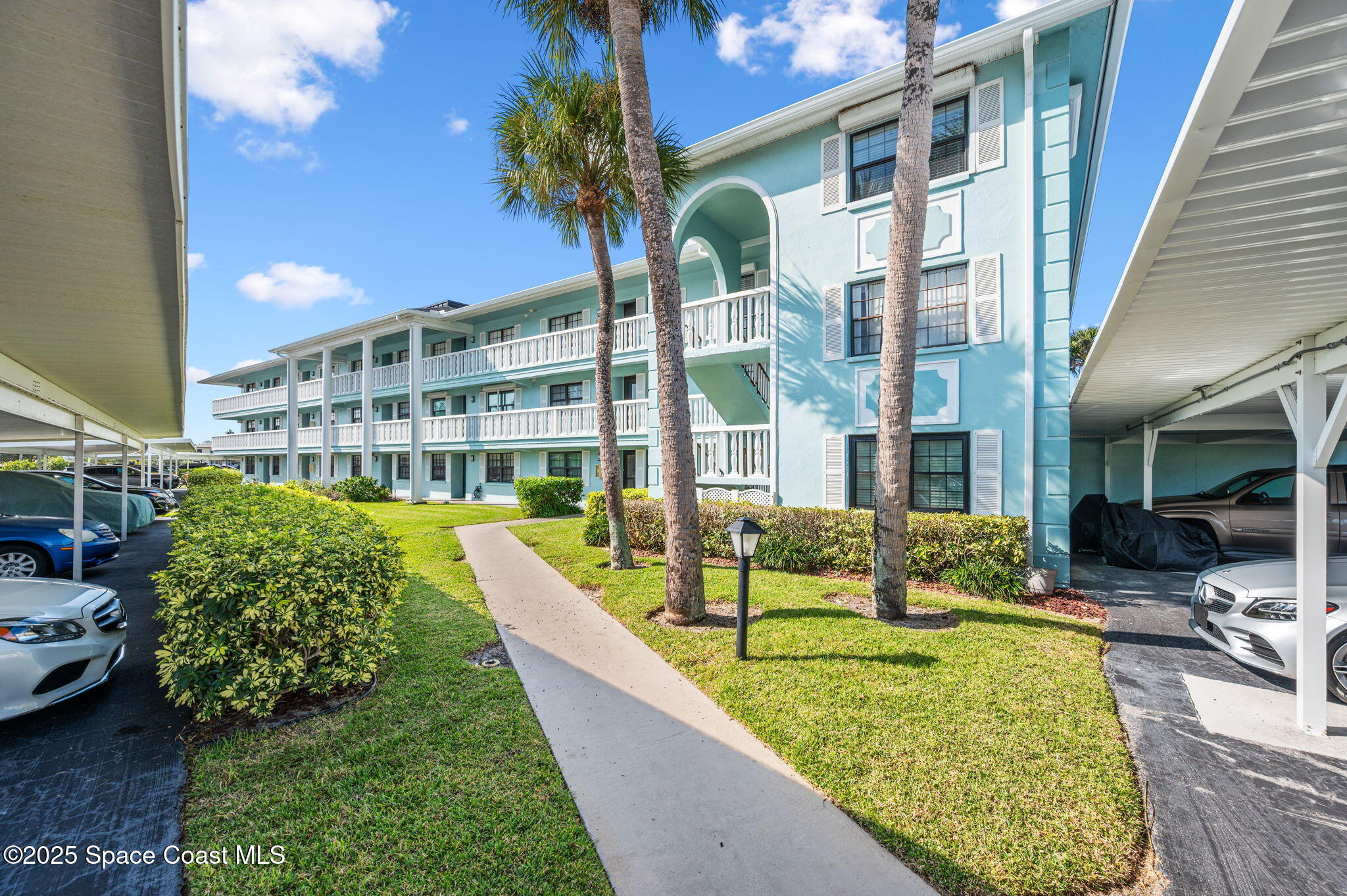 2001 South Banana River Boulevard, Unit 319 Cocoa Beach, FL 32931 - Photo 2 of 45 a view of an house with swimming pool and sitting area