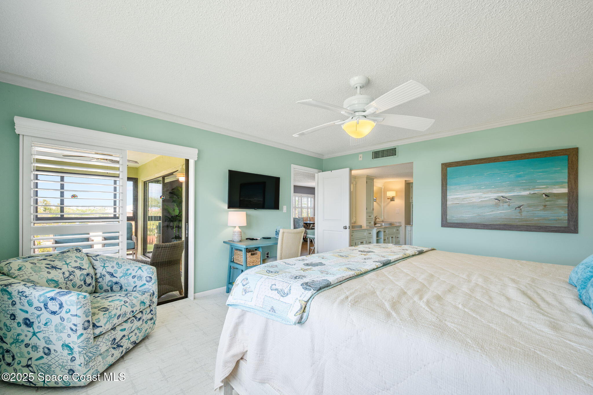 2001 South Banana River Boulevard, Unit 319 Cocoa Beach, FL 32931 - Photo 21 of 45 a bedroom with a bed and a flat screen tv