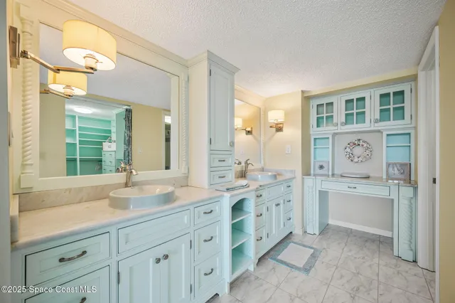 a spacious bathroom with a granite countertop sink mirror and a