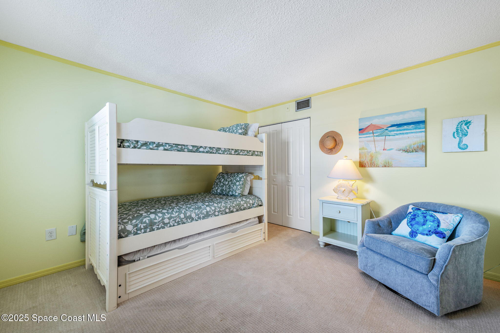 2001 South Banana River Boulevard, Unit 319 Cocoa Beach, FL 32931 - Photo 27 of 45 a living room with furniture and a table