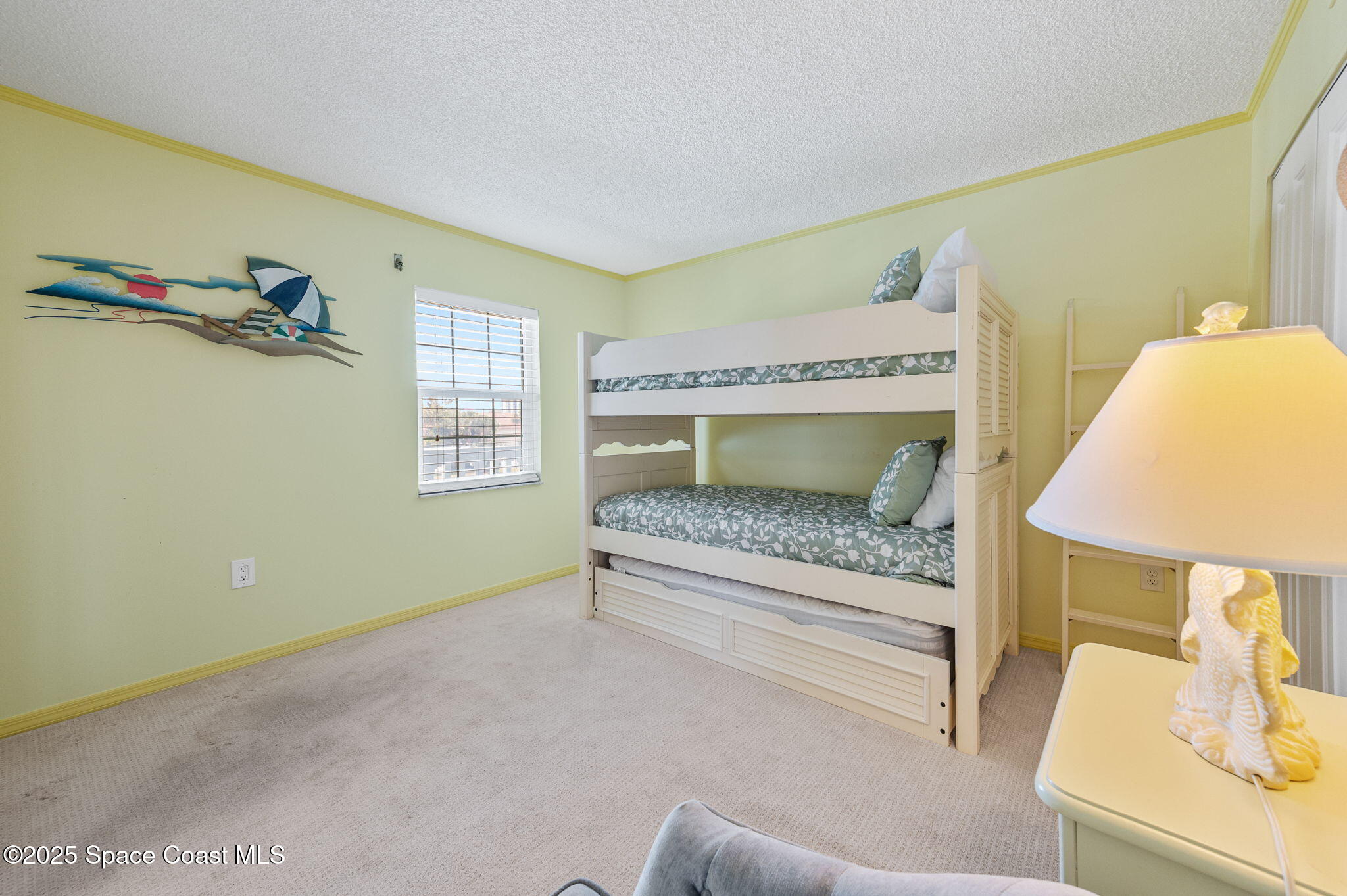 2001 South Banana River Boulevard, Unit 319 Cocoa Beach, FL 32931 - Photo 28 of 45 a bedroom with a bed and a couch