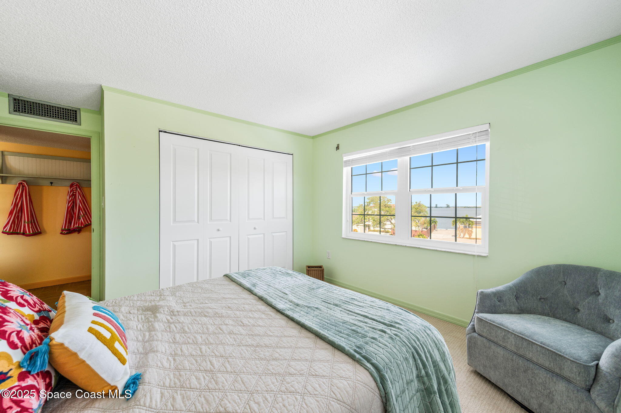 2001 South Banana River Boulevard, Unit 319 Cocoa Beach, FL 32931 - Photo 31 of 45 a bedroom with a bed and a window