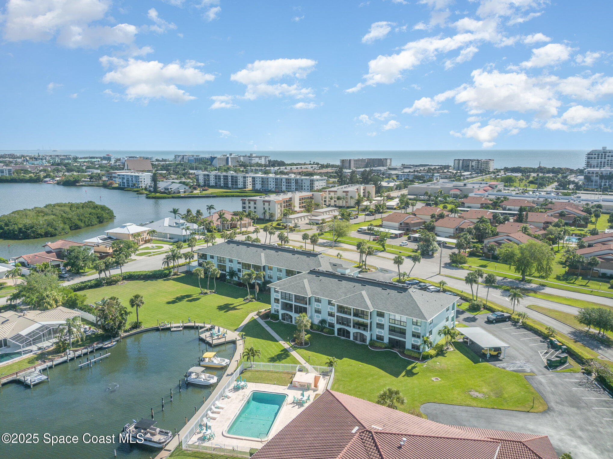 2001 South Banana River Boulevard, Unit 319 Cocoa Beach, FL 32931 - Photo 40 of 45 an aerial view of a house with a swimming pool