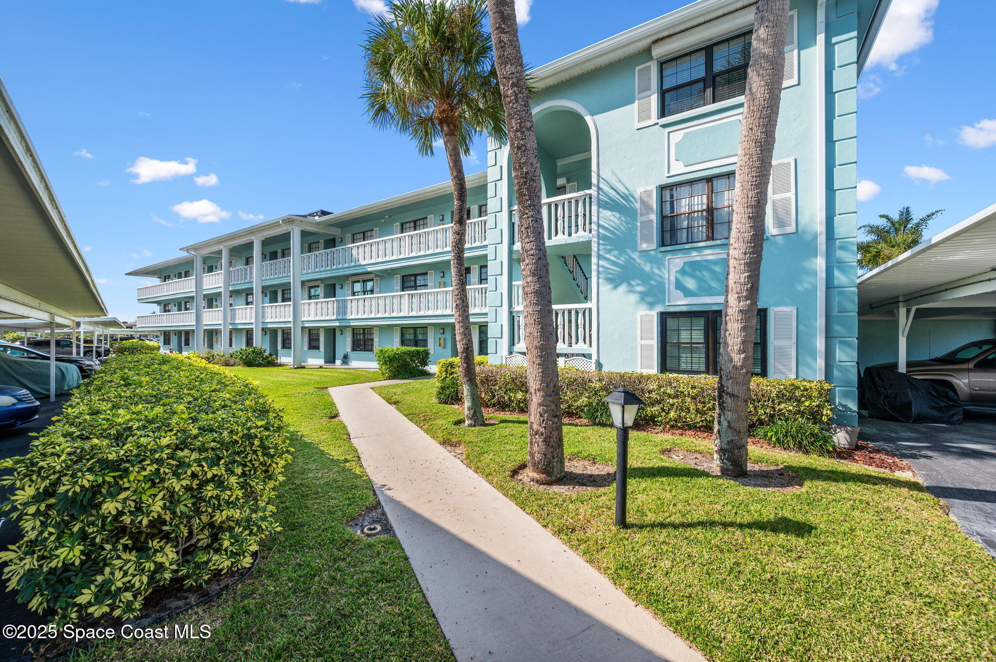 2001 South Banana River Boulevard, Unit 319 Cocoa Beach, FL 32931 - Photo 42 of 45 a view of a house with a yard and sitting area