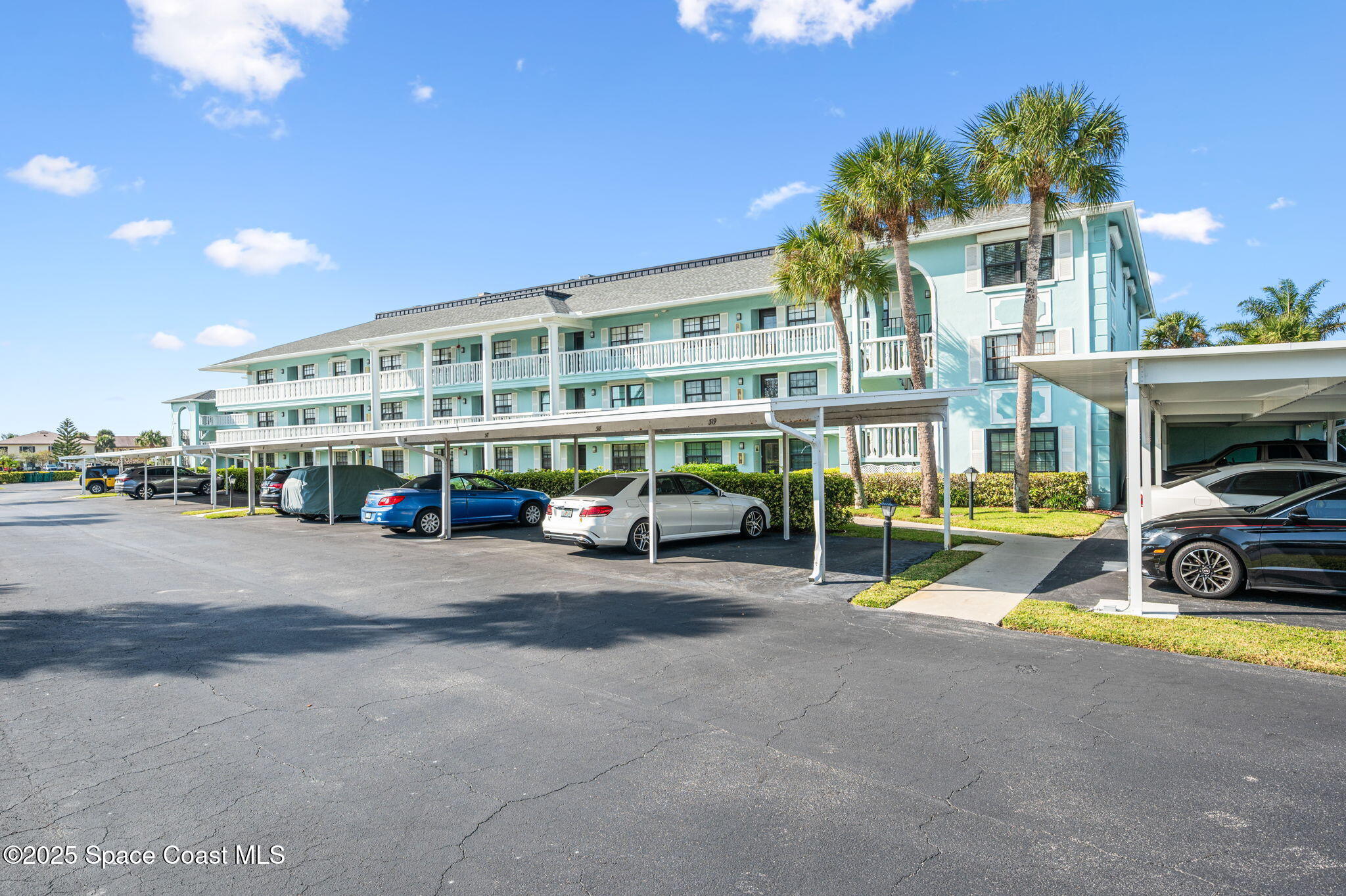 2001 South Banana River Boulevard, Unit 319 Cocoa Beach, FL 32931 - Photo 43 of 45 a car parked in front of a building