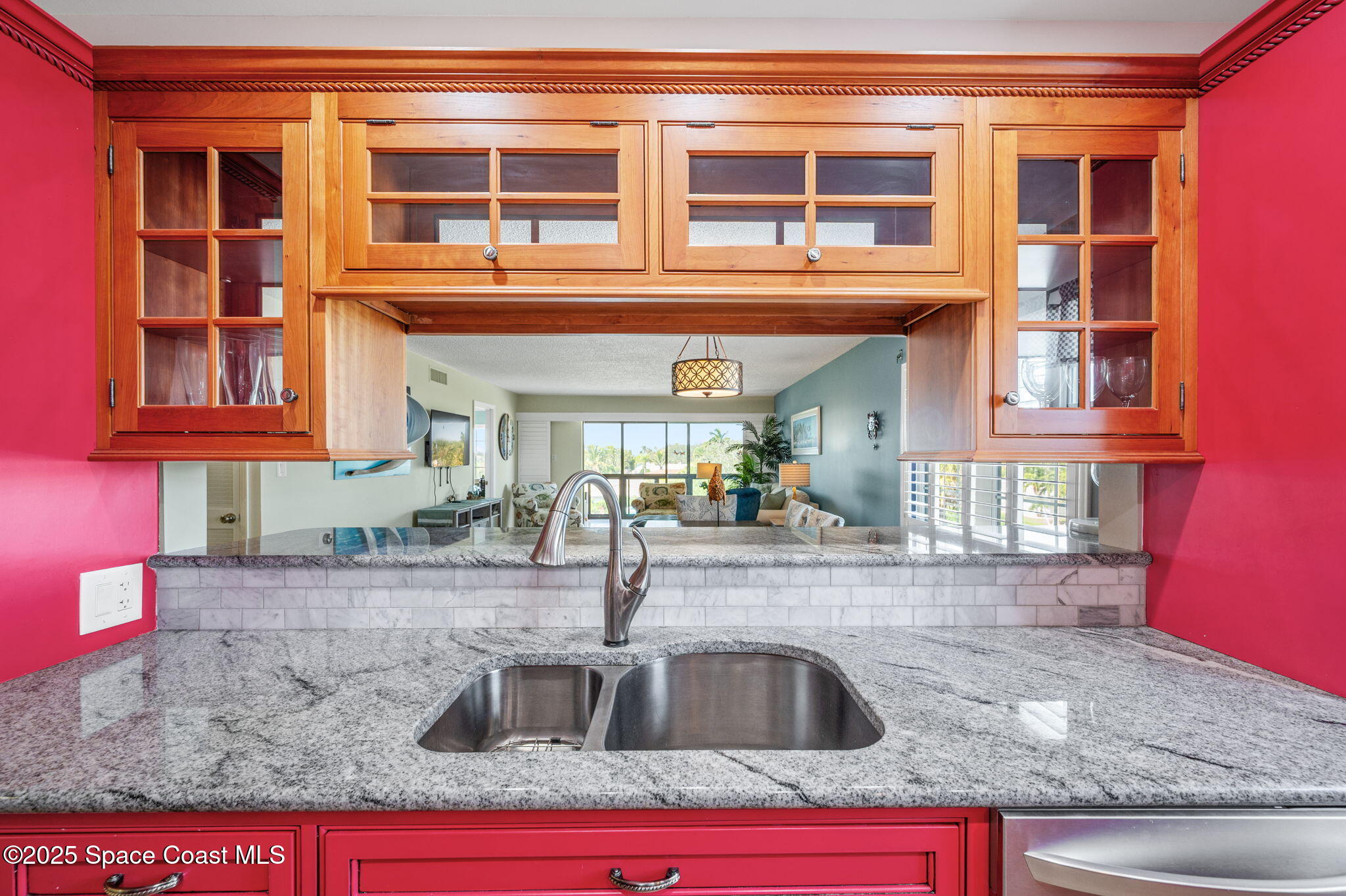 2001 South Banana River Boulevard, Unit 319 Cocoa Beach, FL 32931 - Photo 10 of 45 a kitchen with granite countertop a sink and a stove
