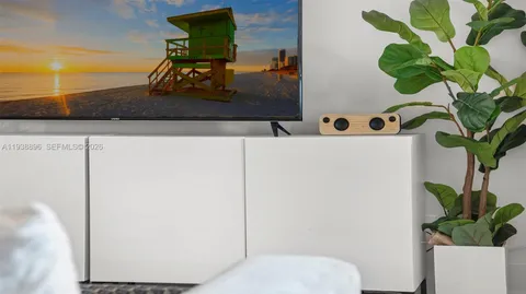 a bathroom with a toilet and a mirror