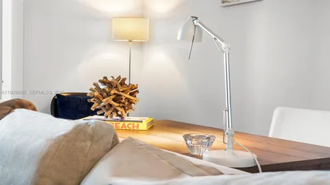 a living room with a couch and a potted plant