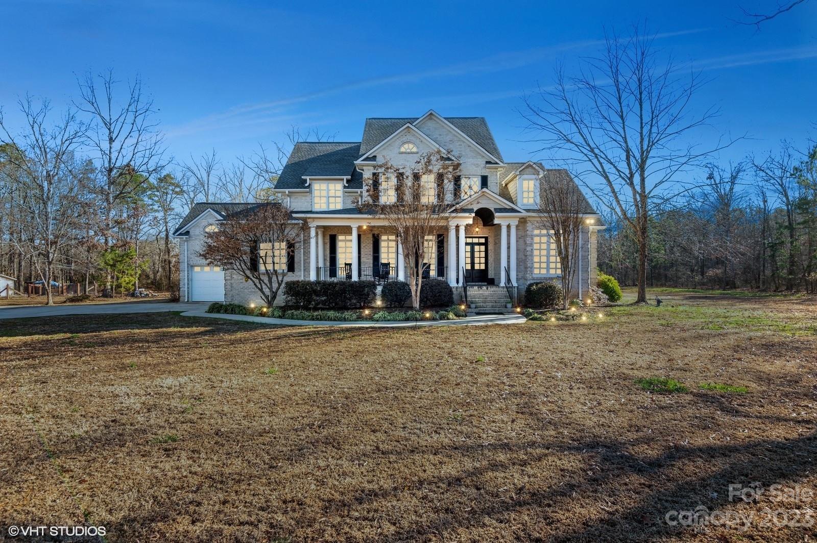 5720 Unionville-Brief Road Monroe, NC 28110 - Photo 1 of 48 a front view of a house with a yard
