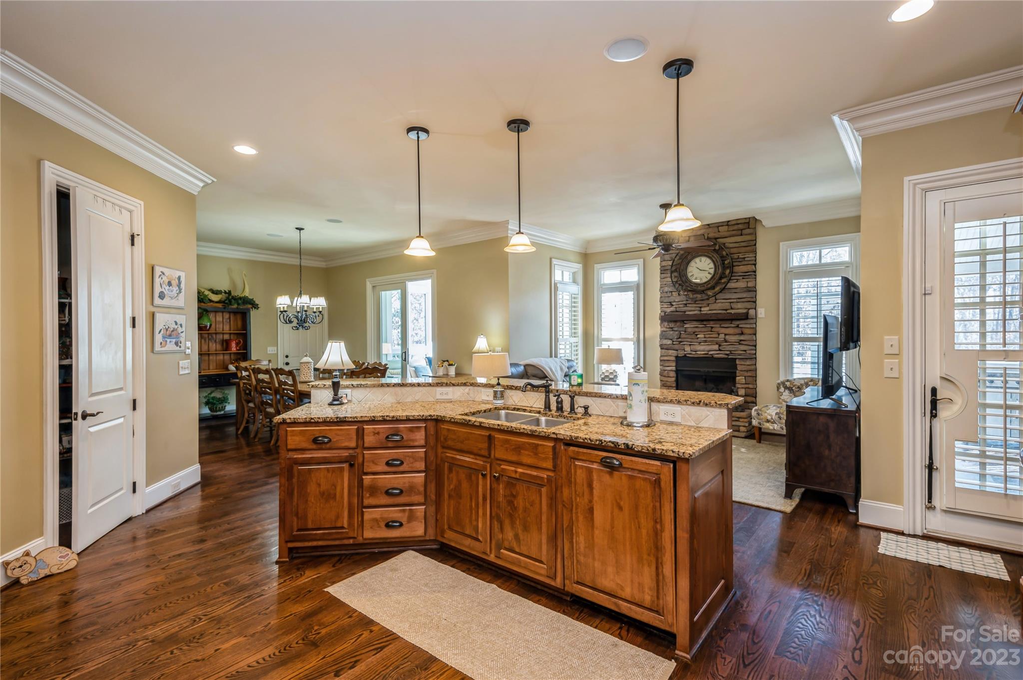 5720 Unionville-Brief Road Monroe, NC 28110 - Photo 13 of 48 a open kitchen with stainless steel appliances granite countertop a sink a stove and a wooden floor