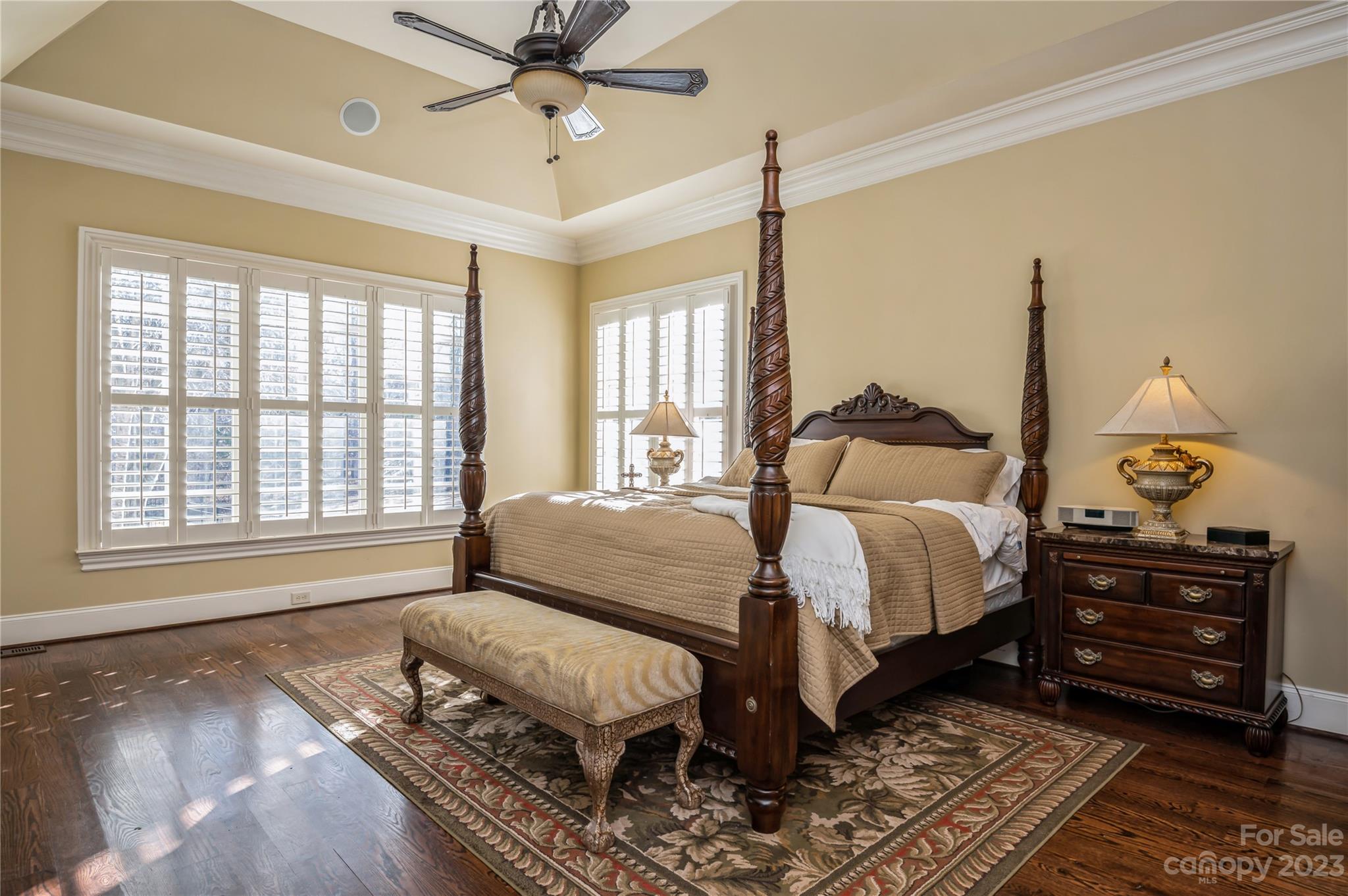 5720 Unionville-Brief Road Monroe, NC 28110 - Photo 19 of 48 a spacious bedroom with a bed a dresser and wooden floor