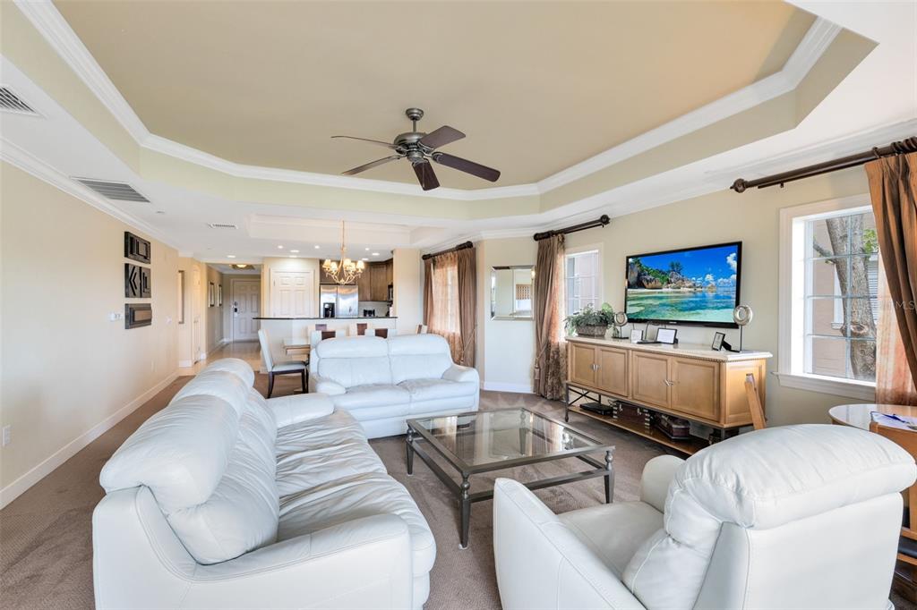 1360 Centre Ct Ridge Drive, Unit 201 Reunion, FL 34747 - Photo 10 of 29 a living room with furniture and a flat screen tv