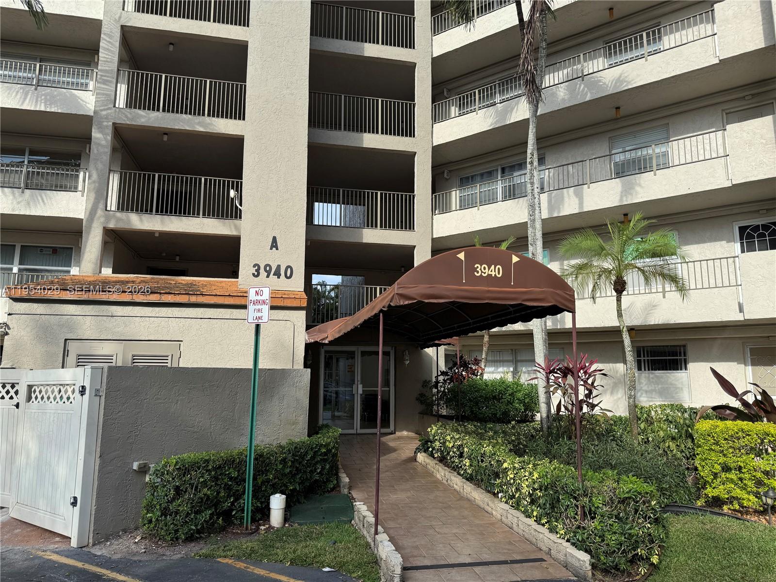 a front view of a building with street view