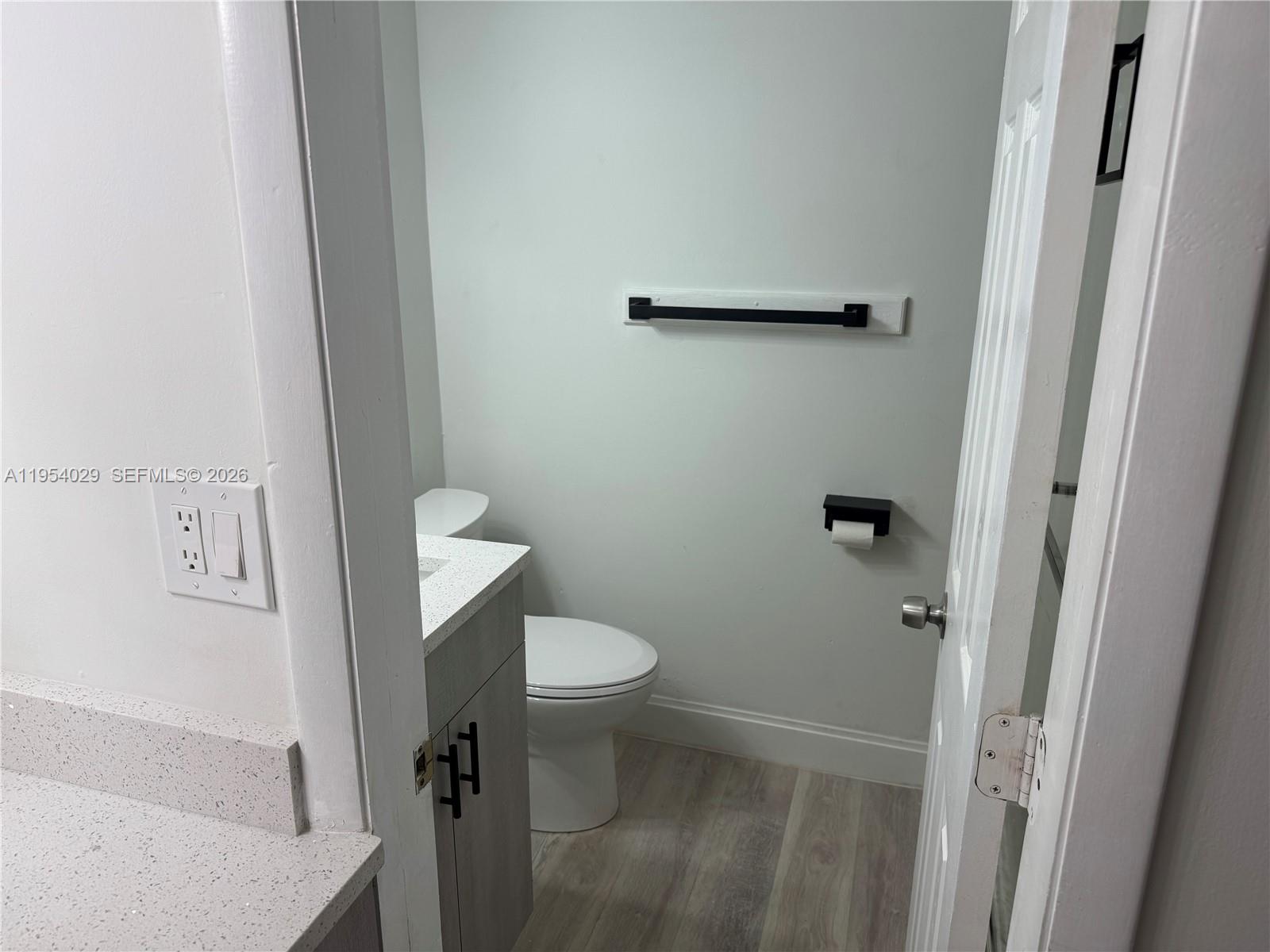 3940 Inverrary Boulevard, Unit 106A Lauderhill, FL 33319 - Photo 6 of 19 a white toilet sitting next to a sink