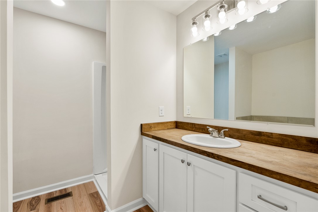 131 Lockaby Road Pelzer, SC 29669 - Photo 27 of 50 This bright bathroom features a spacious vanity with a sink and ample storage beneath.