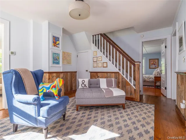a living room with furniture and a rug