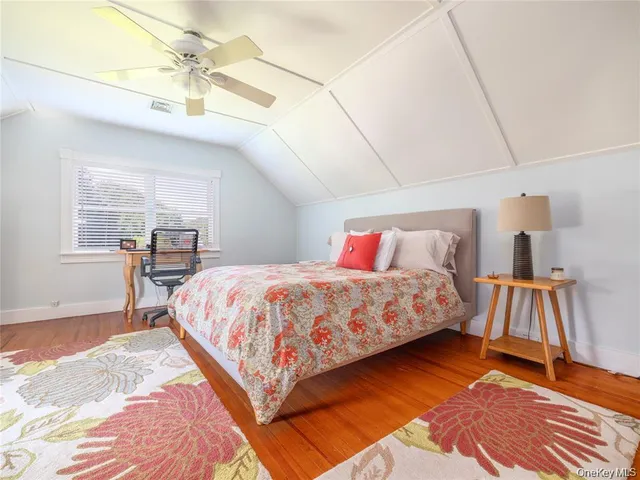 a bedroom with a bed and a walk in closet